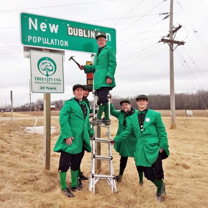 Leprachauns decorating New London sign